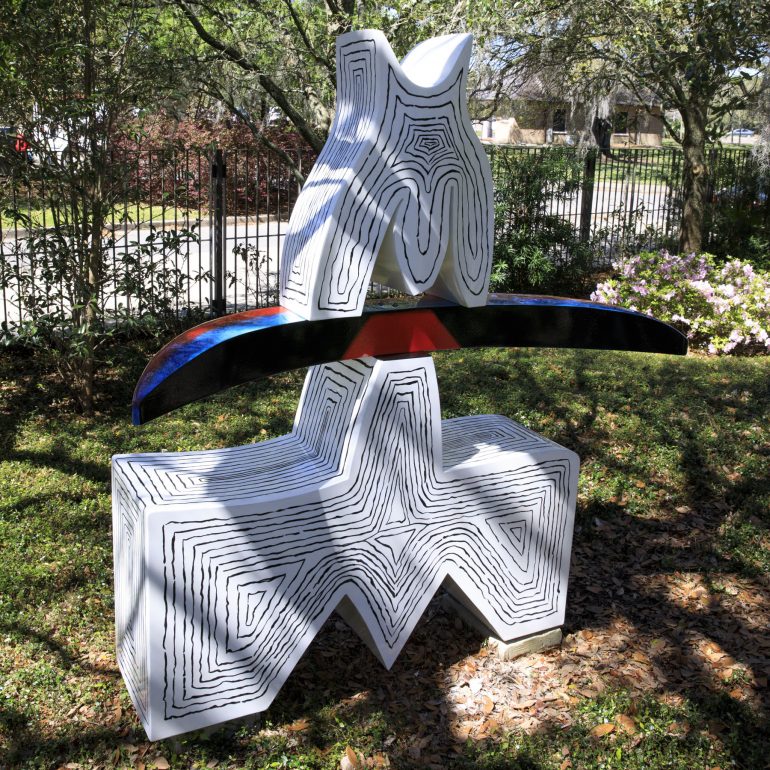 A sculpture by Ida Kohlmeyer in the Besthoff Sculpture Garden is made of abstract painted aluminum shapes.