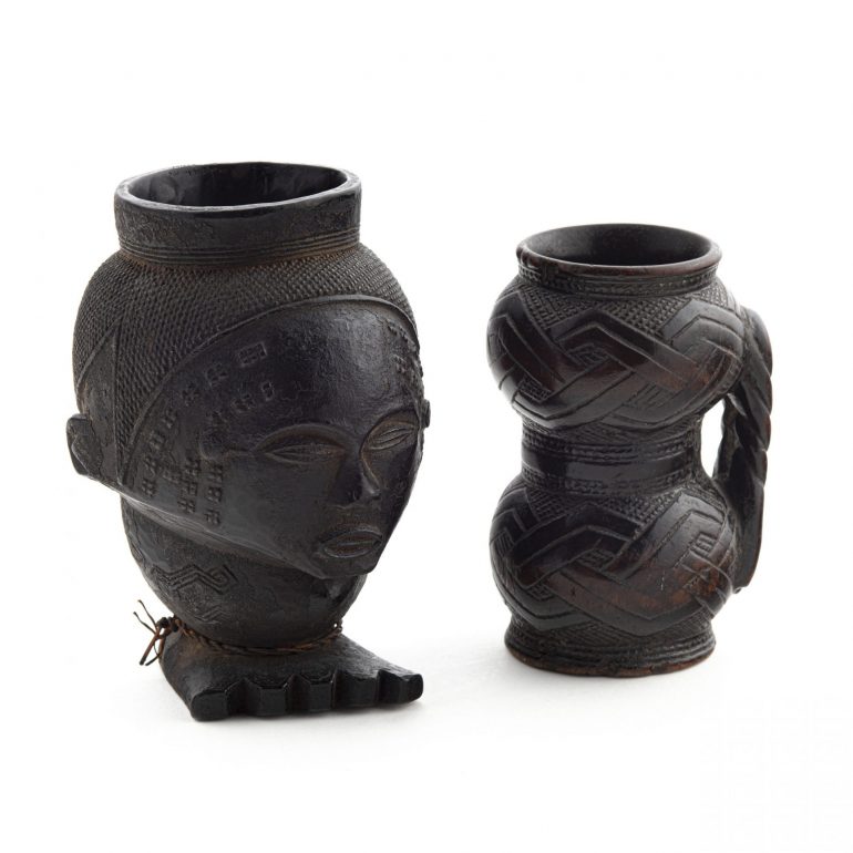 Two elaborately carved wooden palm wine cups