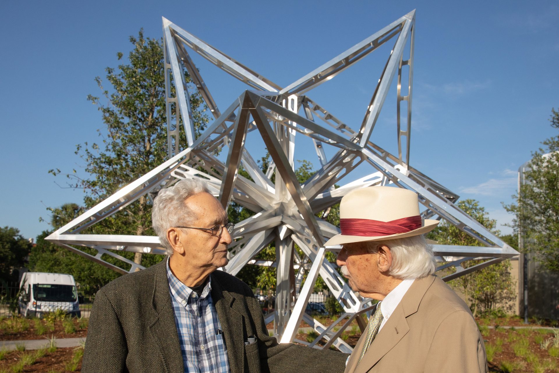 Artist Frank Stella and Sydney Besthoff in front of Stella’s work in the Besthoff Sculpture Garden

